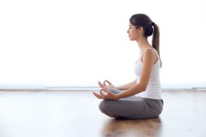 beautiful-young-woman-doing-yoga-exercises-home-e1704219759264.jpg