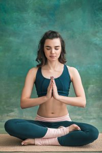 studio-shot-young-fit-woman-doing-yoga-exercises-green-space-1-scaled.jpg